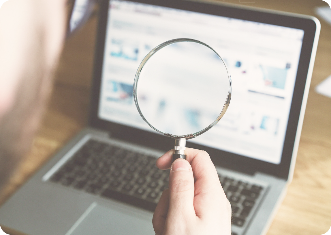 Person analyzing data on laptop
