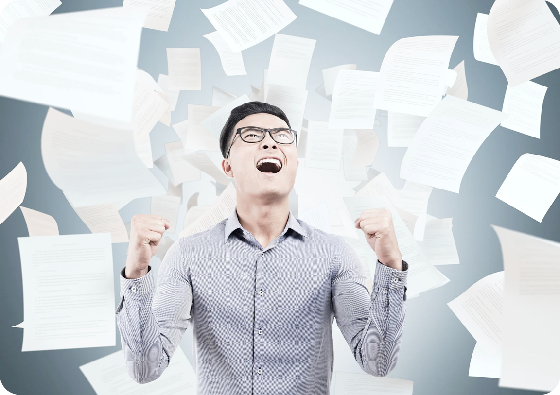 Businessman with falling papers
